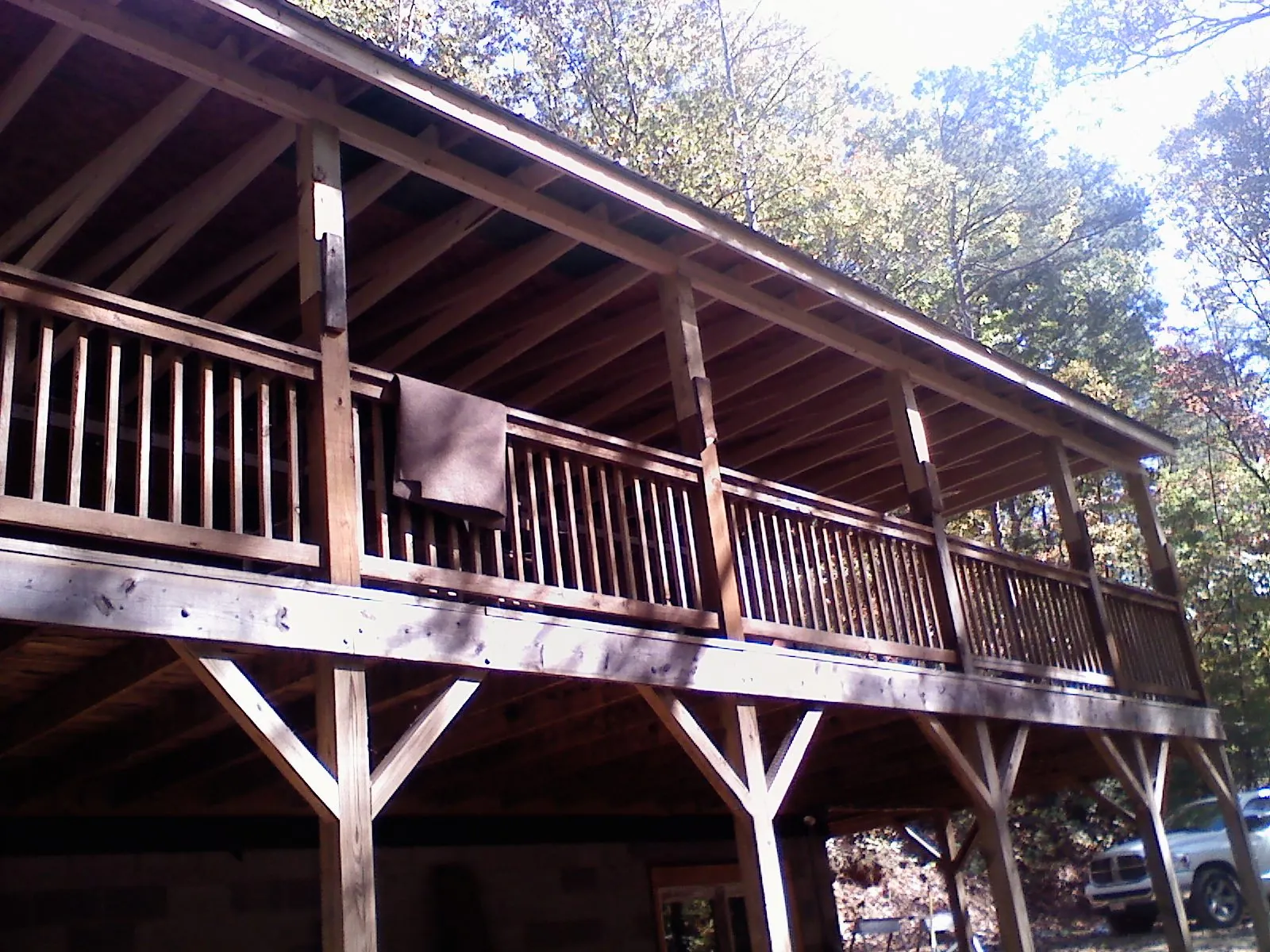 Timber framing under a new elevated porch and deck — Roof Leak Repair in Grand Forks by Roofing Brothers